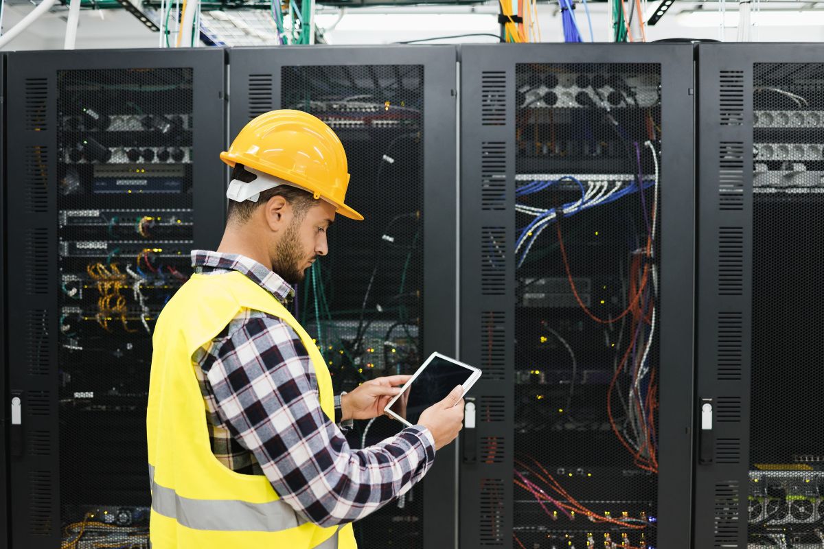 man in tech center holding tablet
